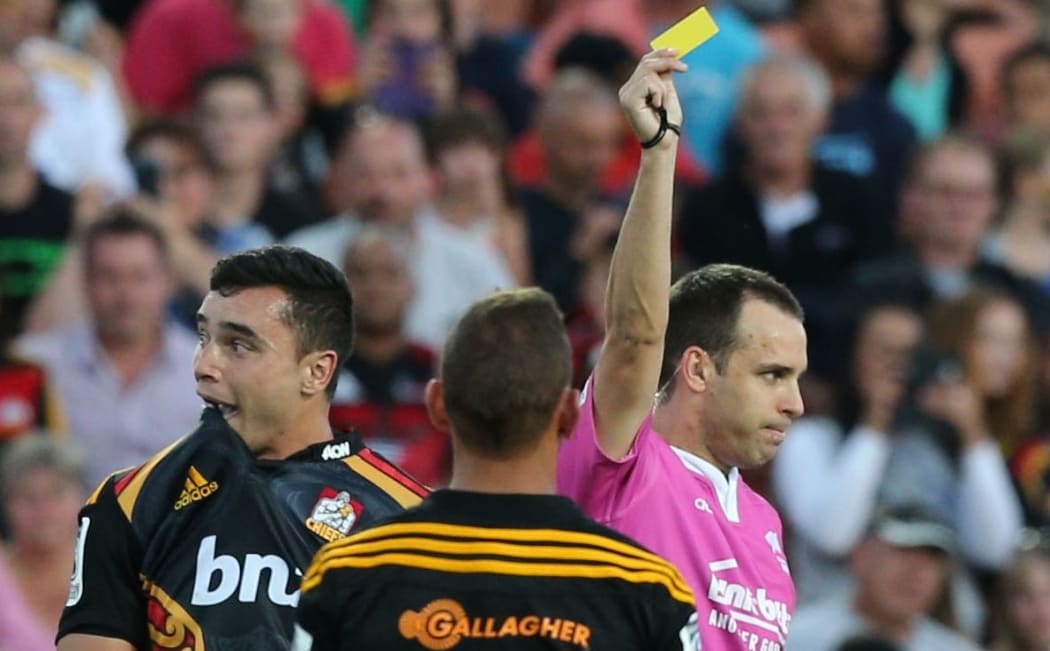 James Lowe is yellow carded by referee Mike Fraser in February, 2015