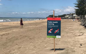 Milford Beach public health warning.