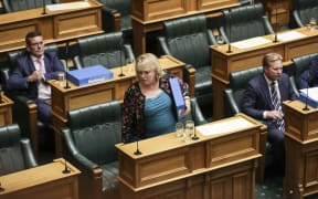 Judith Collins walks out of the House in protest at the Speaker's ejection of Simon Bridges and Gerry Brownlee.