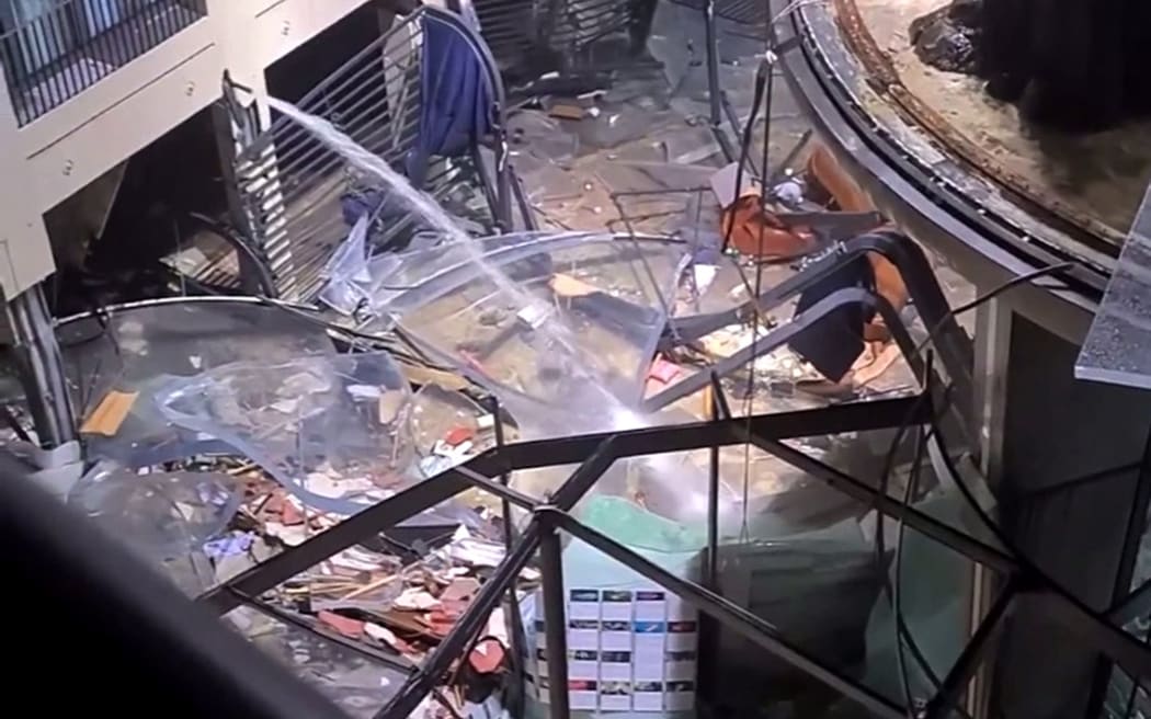 16 December 2022, Berlin: The atrium of a hotel is devastated and lies in ruins. In the Radisson Blue hotel, the huge Sea Life aquarium had burst. Water poured down to the street. - Repetition with other image detail Photo: Iva Yudinski/instagram/tnn/dpa (Photo by Iva Yudinski / instagram/tnn / dpa Picture-Alliance via AFP)