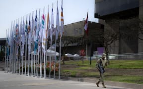 A member of the air force walks past the government complex where the Asia-Pacific Economic Cooperation (APEC) Summit will take place in Lima on November 13, 2024. - Leaders and representatives of the APEC 21 member economies and other commercial guests will meet in Lima from November 14 to 16. (Photo by Luis ACOSTA / AFP)