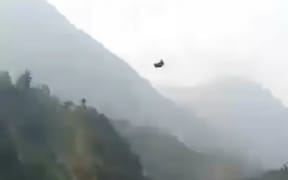 Helicopters have been sent to rescue eight people trapped in cable car over a valley in the Khyber Pakhtunkhwa province.