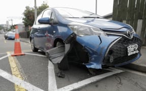 Multiple parked vehicles were damaged by a driver in a stolen vehicle towing a caravan that was fleeing police.