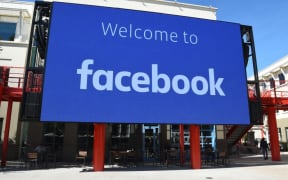 (FILES) In this file photo taken on October 23, 2019 a giant digital sign is seen at Facebook's corporate headquarters campus in Menlo Park, California.