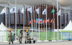 Construction workers go through the Olympic Park in Rio de Janeiro, Brazil, 05 September 2016. The Rio 2016 Paralympic Games will be held 07-18 September