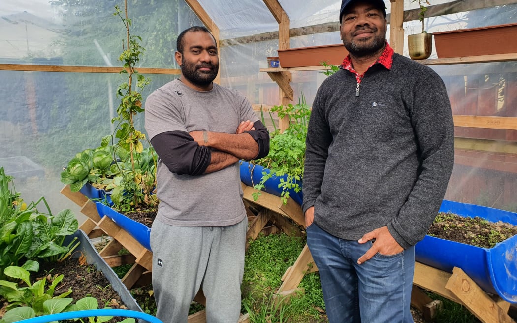 Mosese Vilivilioyawa (left) and Dr Esala Vakamacawai in the hothouse Mosese built.