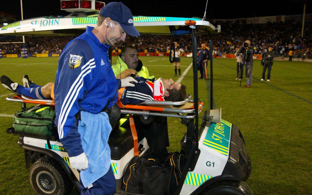 17 May 2003, Rugby Union Super 12, Semi-Final, Blues vs Brumbies, Eden Park, Auckland, New Zealand.
Steve Devine gets stretchered from the field
Pic: Sandra Teddy/Photosport