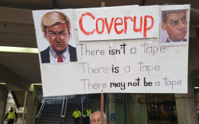 A protest sign references Bill English's handling of Todd Barclay's employment dispute.