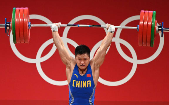 China's Lyu Xiaojun competes in the men's 81kg weightlifting competition during the Tokyo 2020 Olympic Games at the Tokyo International Forum in Tokyo on July 31, 2021.