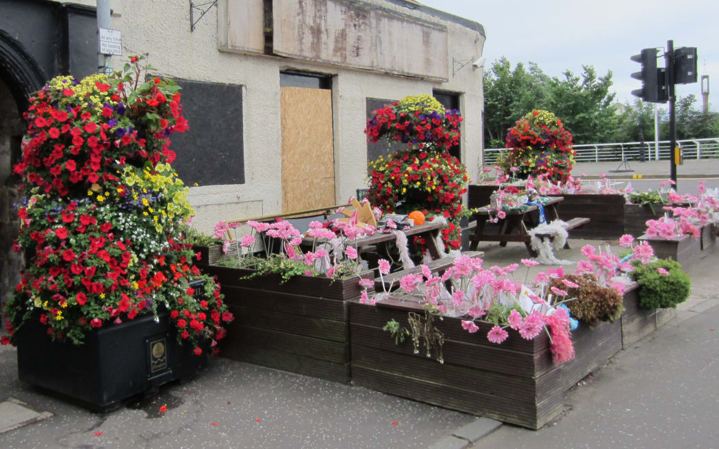 Tributes at the derelict Clutha pub.