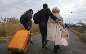 Refugees from Ukraine are seen after crossing Ukrainian-Polish border due to Russian military attack on Ukraine. Medyka, Poland on February 25, 2022.