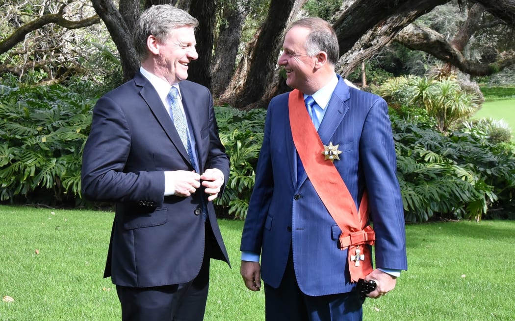 Former PM Sir John Key (right), talking after his investiture with current PM Bill English.