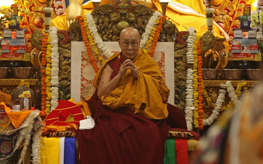 Tibetan spiritual leader the Dalai Lama attends a long-life prayer offering ceremony at the Main Tibetan Temple in McLeod Ganj, near Dharamsala on July 5, 2025. The Dalai Lama said on July 5 he dreamed of living for decades more, as the Buddhist spiritual leader prayed with thousands of exiled Tibetans on the eve of his 90th birthday. (Photo by Sanjay BAID / AFP)