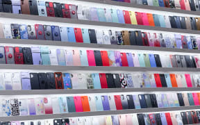 Store featuring cases for phones (Photo by Philippe TURPIN / Photononstop / Photononstop via AFP)