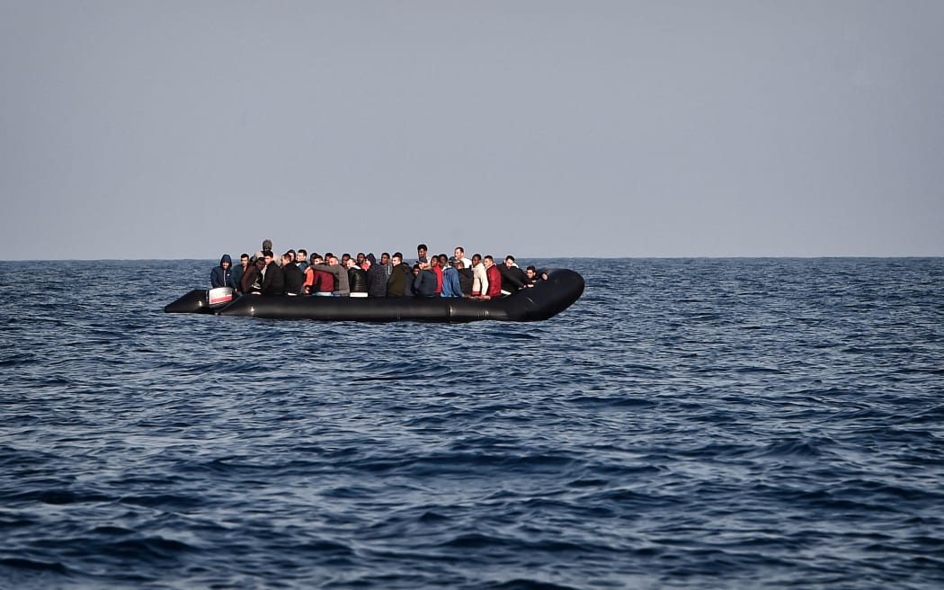 A rubber boat with migrants is seen off the Libya coast (file image).