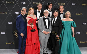 Cast members from "Succession" (from L) US actor Alan Ruck, Australian actress Sarah Snook, Swedish actor Alexander Skarsgard, Scottish actor Brian Cox, US actor Nicholas Braun, US actor Kieran Culkin, British actor Matthew Macfadyen and US actress J. Smith-Cameron pose in the press room with the award for Outstanding Drama Series during the 75th Emmy Awards at the Peacock Theatre at L.A. Live in Los Angeles on January 15, 2024.