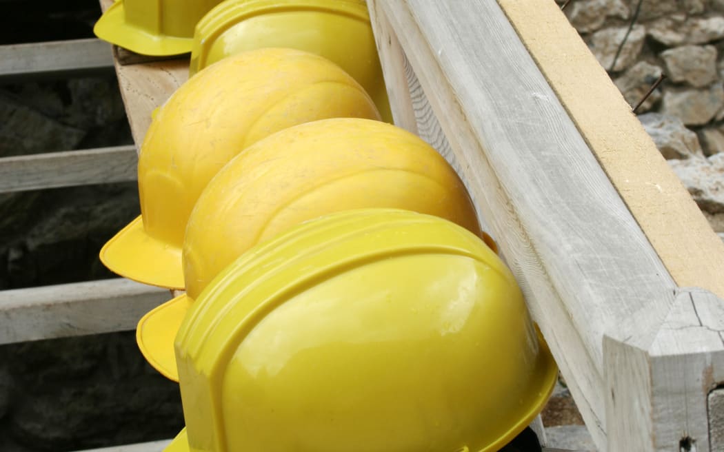 A row of mine workers' hard hats