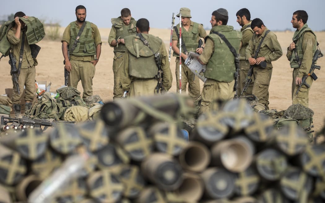 Israeli soldiers on the southern Israeli border with the Gaza Strip after the proposed three-day truce collapsed.