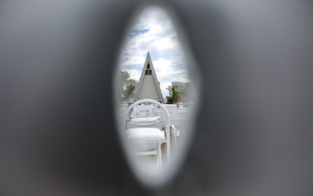 Looking though one of the white seats representing people that died in the February 2011 earthquake in Christchurch.