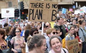 Student demonstrators and thousands of environmentalists gather holding banners for the Climate Strike to draw the attention of government on global warming and climate change, in Melbourne, Australia on September 20, 2019.