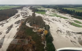 Digging trenches for anchored tree protection in the Hakatere/Ashburton River.