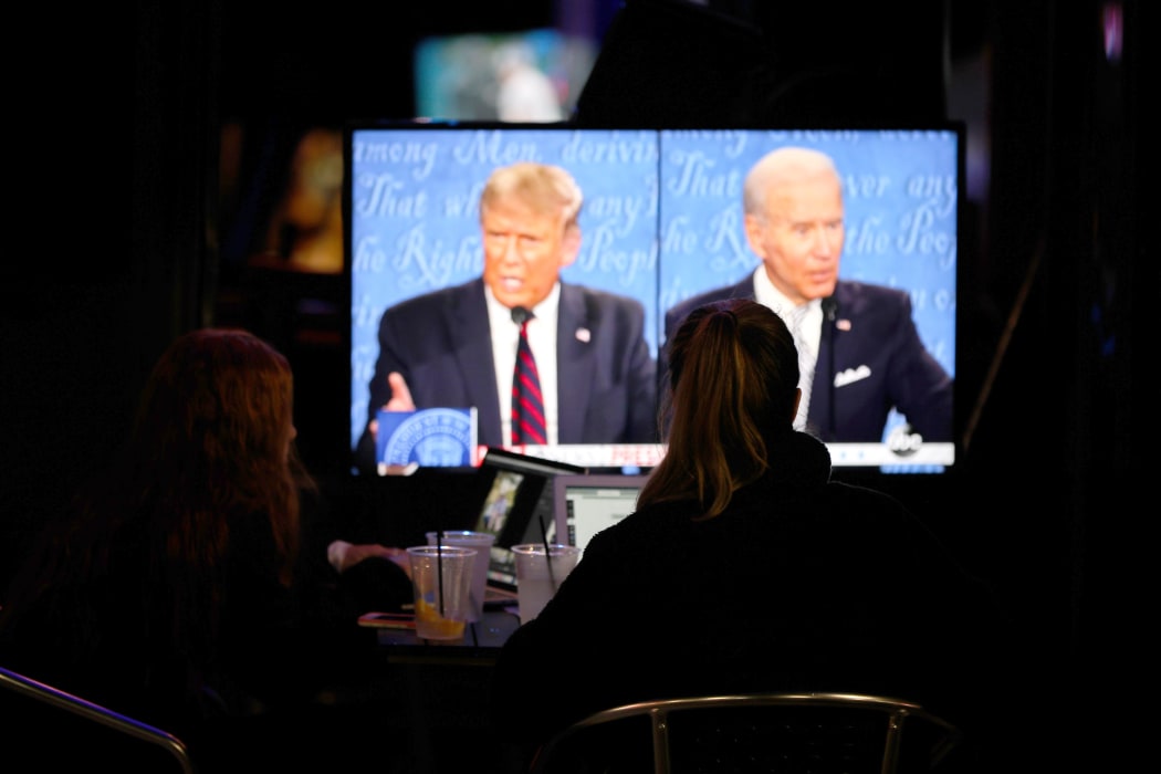 People watch the first presidential debate between US President Donald Trump and former US Vice President Joe Biden.