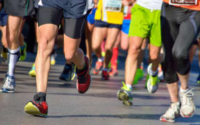 Runners on a road.