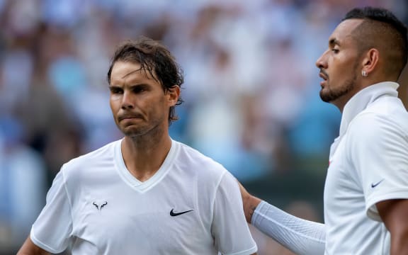 Nick Kyrgios congratulates Rafael Nadal on his win at Wimbledon in 2019