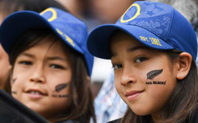 New Zealand supporters pose prior to the Japan 2019 Rugby World Cup Pool B match between New Zealand and Namibia at the Tokyo Stadium in Tokyo on October 6, 2019.