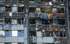 Close up view of the exterior of the Grenfell Tower block of flats in which at least 80 people lost their lives in a fire. In the Australian state of Victoria $600m is being used to fund remedial work.