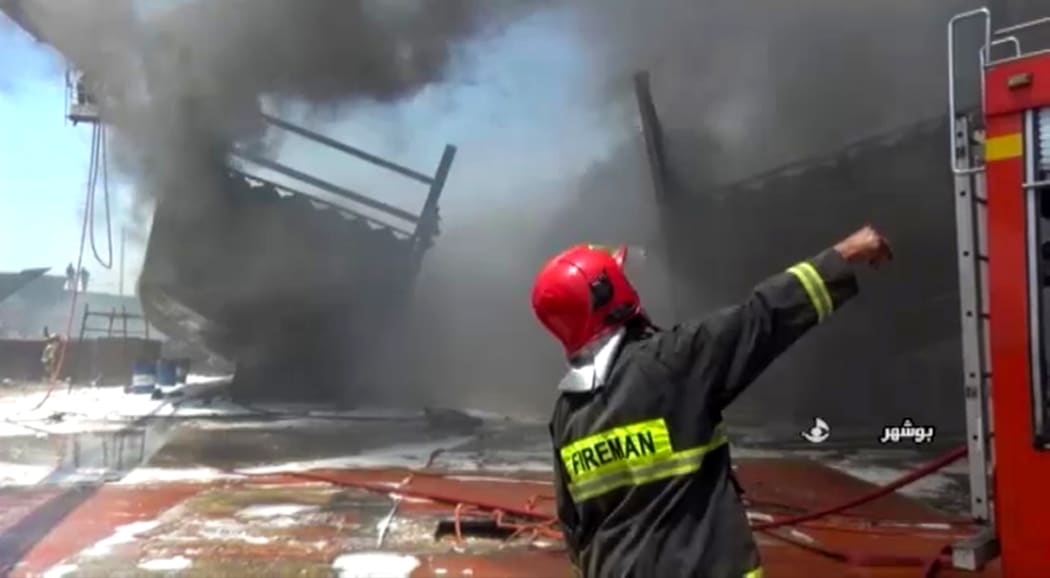 Firefighters combatting a blaze at the Delvar Kashti Bushehr boat factory in the Iranian city of Bushehr.