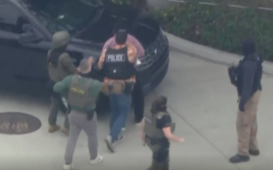 Television news footage earlier in the day showed caravans of unmarked military-style vehicles and vans loaded with uniformed federal agents streaming through Los Angeles streets as part of the immigration enforcement operation.