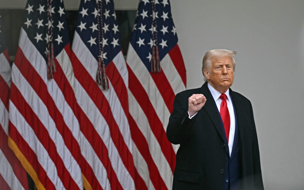 US President Donald Trump pumps his fist as he arrives to delivers remarks on reciprocal tariffs during an event in the Rose Garden entitled "Make America Wealthy Again" at the White House in Washington, DC, on April 2, 2025. Trump geared up to unveil sweeping new "Liberation Day" tariffs in a move that threatens to ignite a devastating global trade war. Key US trading partners including the European Union and Britain said they were preparing their responses to Trump's escalation, as nervous markets fell in Europe and America.