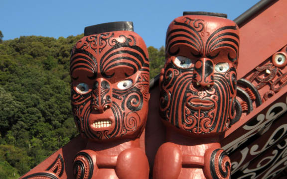 Carved figures on the amo - the posts on either side of the front of the wharenui.