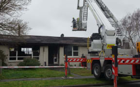 A fire service crew at the scene of the Parklands house fire in Christchurch.
