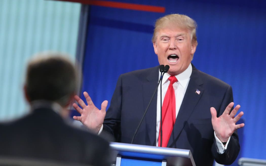 CLEVELAND, OH - AUGUST 06:  Republican presidential candidate Donald Trump fields a question during the first Republican presidential debate hosted by Fox News and Facebook at the Quicken Loans Arena on August 6, 2015 in Cleveland, Ohio. 
Scott Olson/Getty Images/AFP