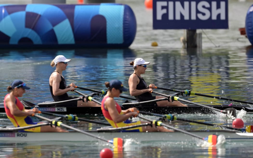 (TOP L-R) New Zealand's Brooke Francis and New Zealand's Lucy Spoors croos the finish line ahead of Romania's Ancuta Bodnar (L) and Romania's Simona Radis in the women's double sculls final rowing competition at Vaires-sur-Marne Nautical Centre in Vaires-sur-Marne during the Paris 2024 Olympic Games on August 1, 2024. (Photo by Bertrand GUAY / AFP)