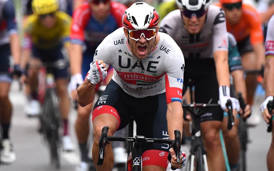 Team UAE Emirates rider Norway's Alexander Kristoff celebrates as he crosses the finish line of  the 1st stage of the 107th edition of the Tour de France cycling race, 156 km between Nice and Nice, on August 29, 2020. (Photo by Stuart Franklin / POOL / AFP)