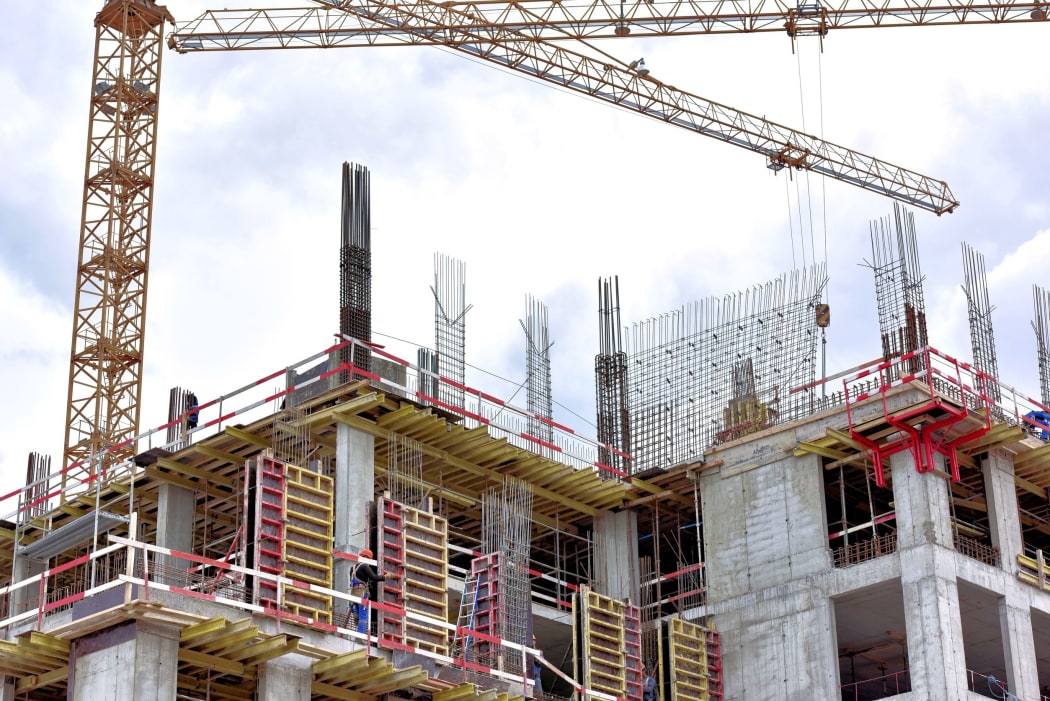 A new building is being constructed with use of tower crane