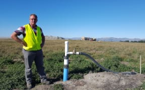 Christchurch City Council's landfill aftercare officer, Grant Gillard, checks out one of the current gas wells at the Burwood Landfill site.