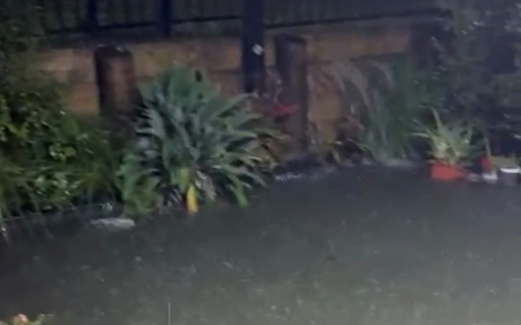 Flooding in a Mt Roskill front yard on Friday night.