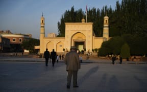 A Uyghur man walks towards the Id Kah mosque for Eid al-Fitr prayers in Kashgar, in China's western Xinjiang region, June 2019.