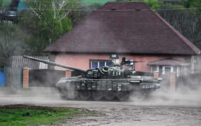 A Russian T-80 tank moves in the Kharkiv direction, Ukraine.