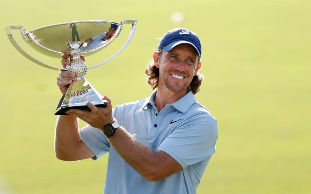 Tommy Fleetwood of England holds the FedEx Cup following his win in the final round of the PGA Tour Championship, 2025.