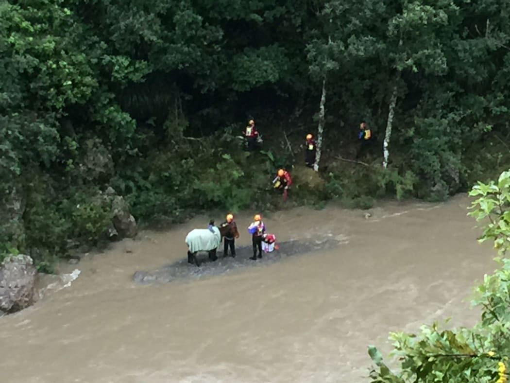 The two year old horse named Poppy was stranded down a steep bank alongside rapidly rising flood water yesterday.