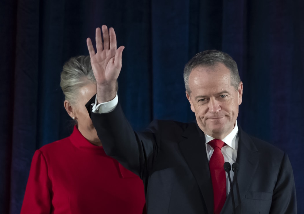 Australian Labor leader Bill Shorten gestures on stage with his wife Chloe, at the Federal Labor Reception in Melbourne, Australia after conceding defeat to Prime Minister Scott Morrison in the country's general election.