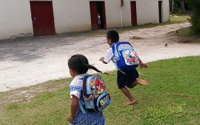 220414. Photo RNZ. Niue and Cook Islands. School kids running