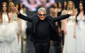 (FILES) Italian fashion designer Roberto Cavalli attends his fashion show on late evening on June 10, 2013, in the Montenegrin coastal town of Budva. Italian fashion designer Roberto Cavalli has died at 83, Italian medias announced on April 12, 2024. (Photo by SAVO PRELEVIC / AFP)