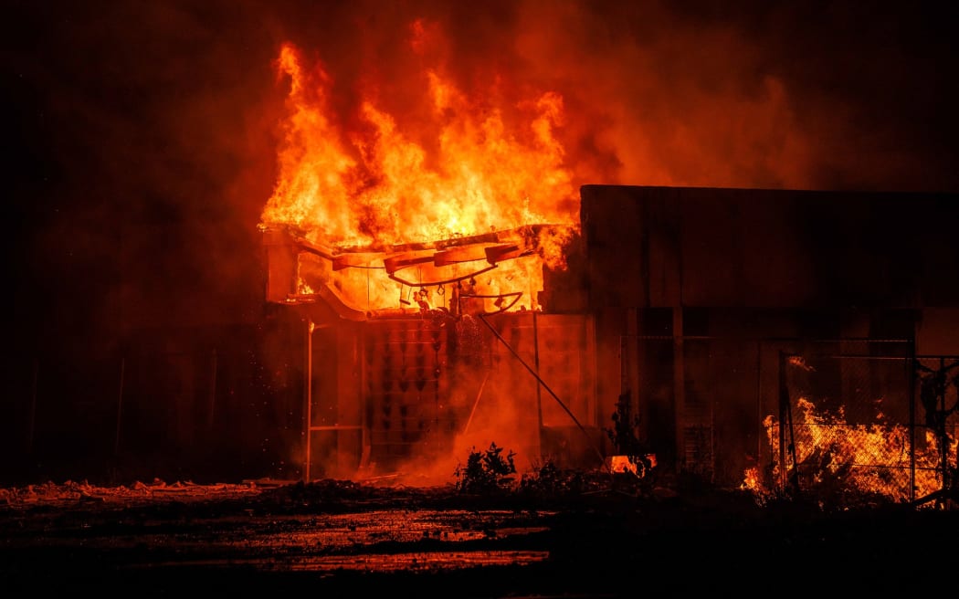 Nitjela up in flames: Marshall Islands firefighters try to contain the fire.