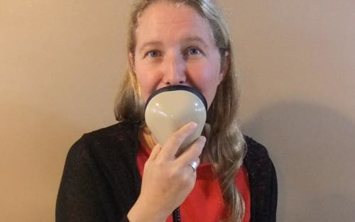 Audio Descripber Nicola Owen talks into a stenomask.